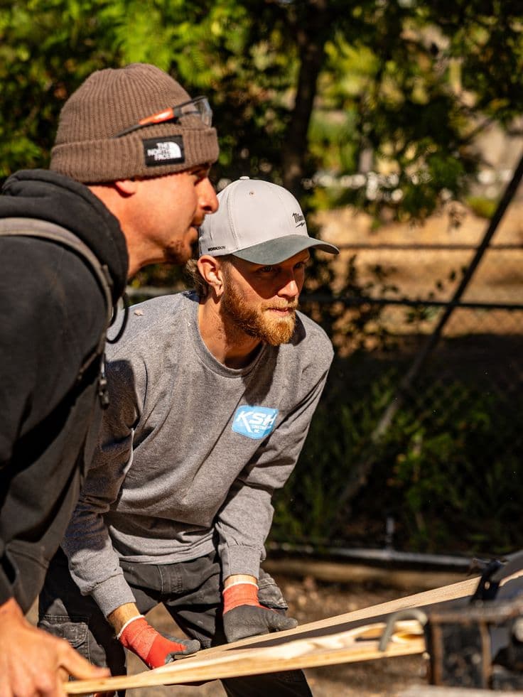 Builders collaborating on site